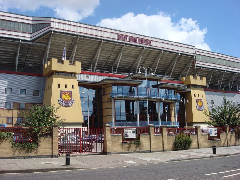 The front of the main stand at the Boleyn Ground, Upton Park, with two castle-style towers carrying the West Ham United crest